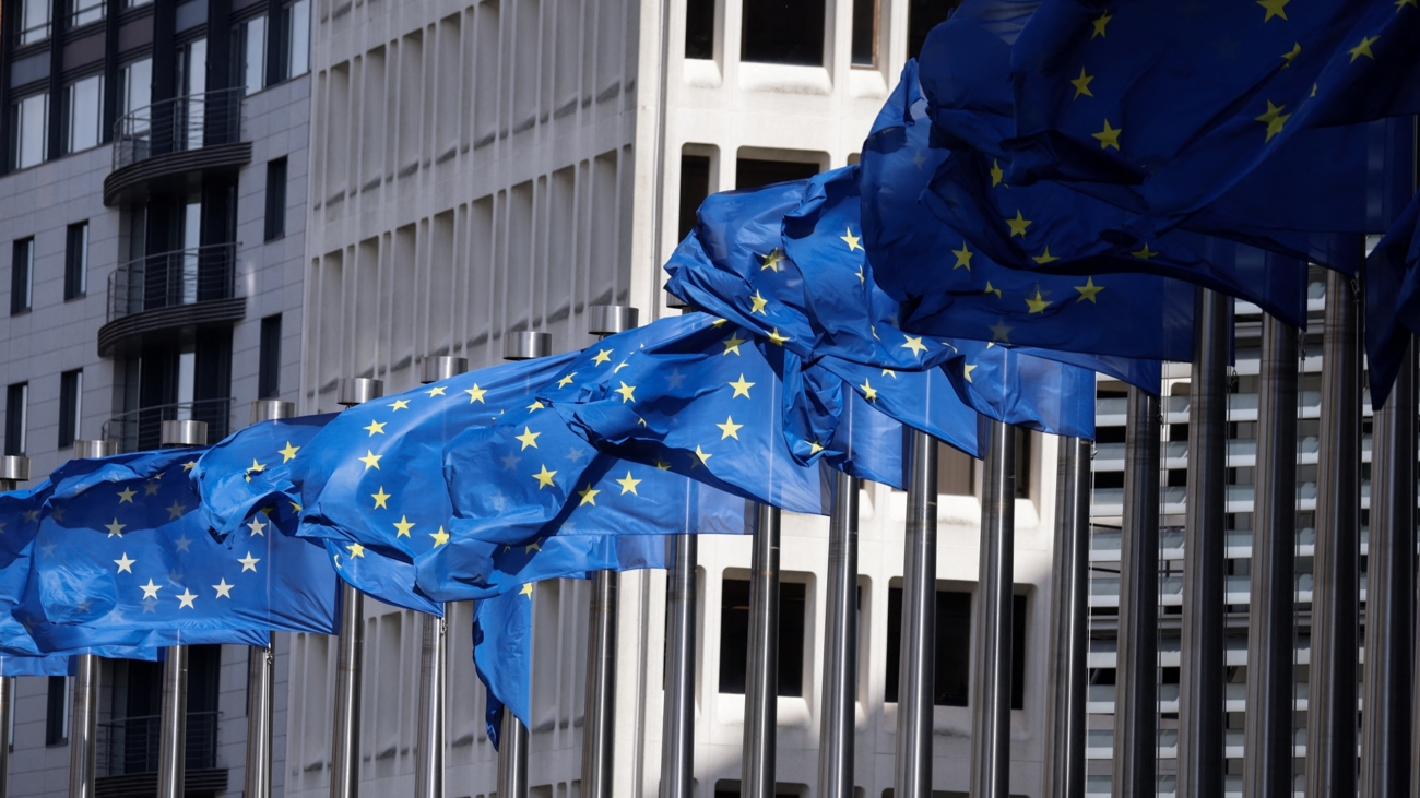 European Union flags fly outside the European Commission building in Brussel on April 12, 2024. (Photo by Kenzo TRIBOUILLARD / AFP)