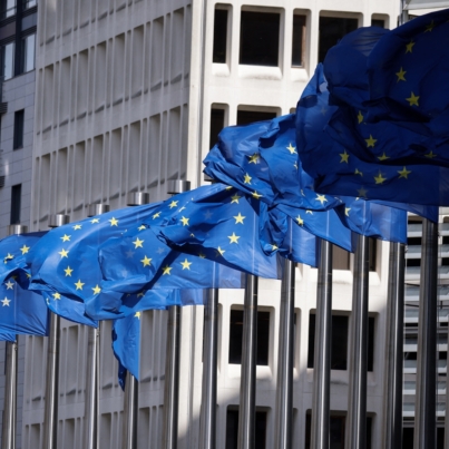 European Union flags fly outside the European Commission building in Brussel on April 12, 2024. (Photo by Kenzo TRIBOUILLARD / AFP)