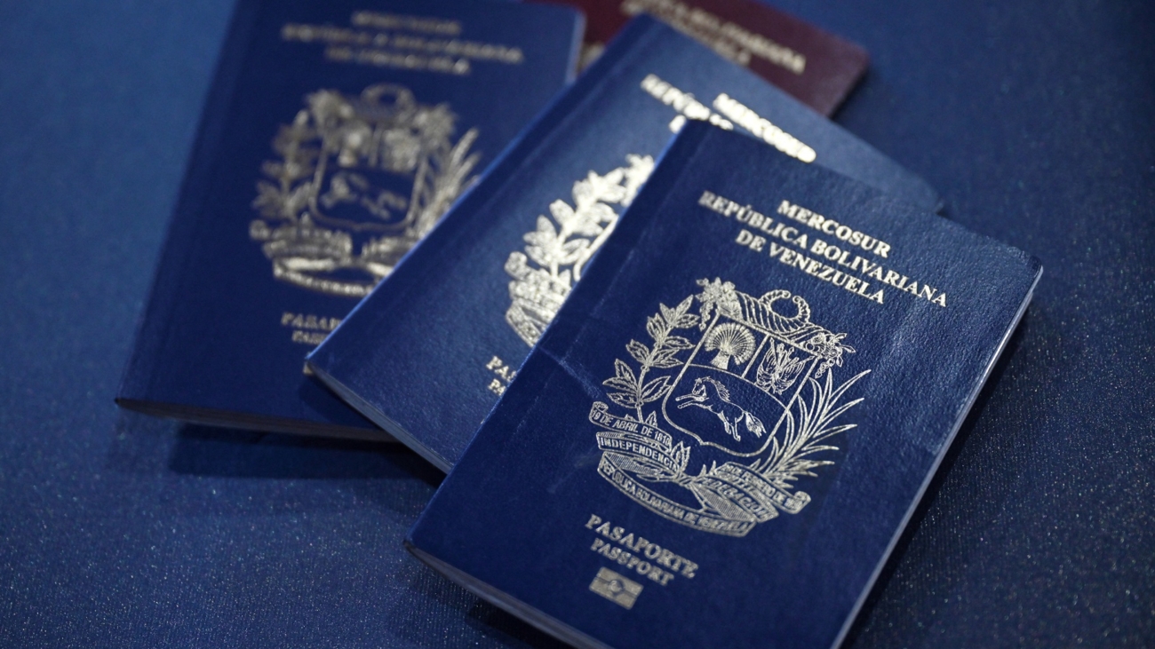 Venezuelan passports are pictured in Caracas on October 3, 2024. - Venezuela will require its citizens abroad to have valid documents to enter the country, confirmed on September 2 by the Minister of Transportation, leaving behind an old regulation that allowed entry with expired passports or identity cards. (Photo by Juan Barreto / AFP)