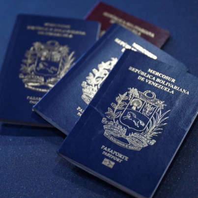 Venezuelan passports are pictured in Caracas on October 3, 2024. - Venezuela will require its citizens abroad to have valid documents to enter the country, confirmed on September 2 by the Minister of Transportation, leaving behind an old regulation that allowed entry with expired passports or identity cards. (Photo by Juan Barreto / AFP)