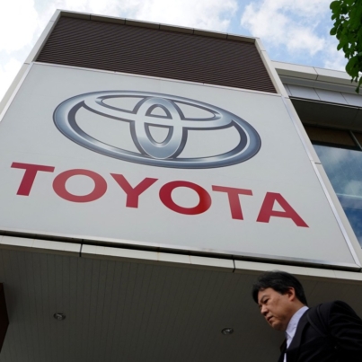The logo of Toyota Motor is displayed at a car showroom in Tokyo on May 8, 2025. (Photo by Kazuhiro NOGI / AFP)