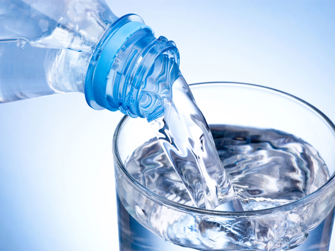 bottled-water-poured-glass-37392749