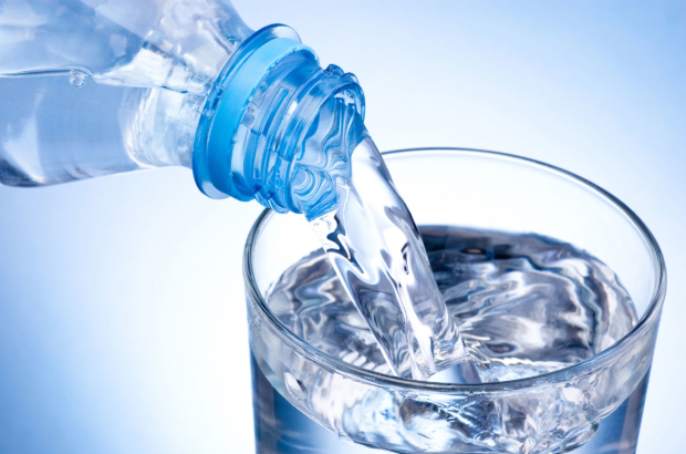 bottled-water-poured-glass-37392749